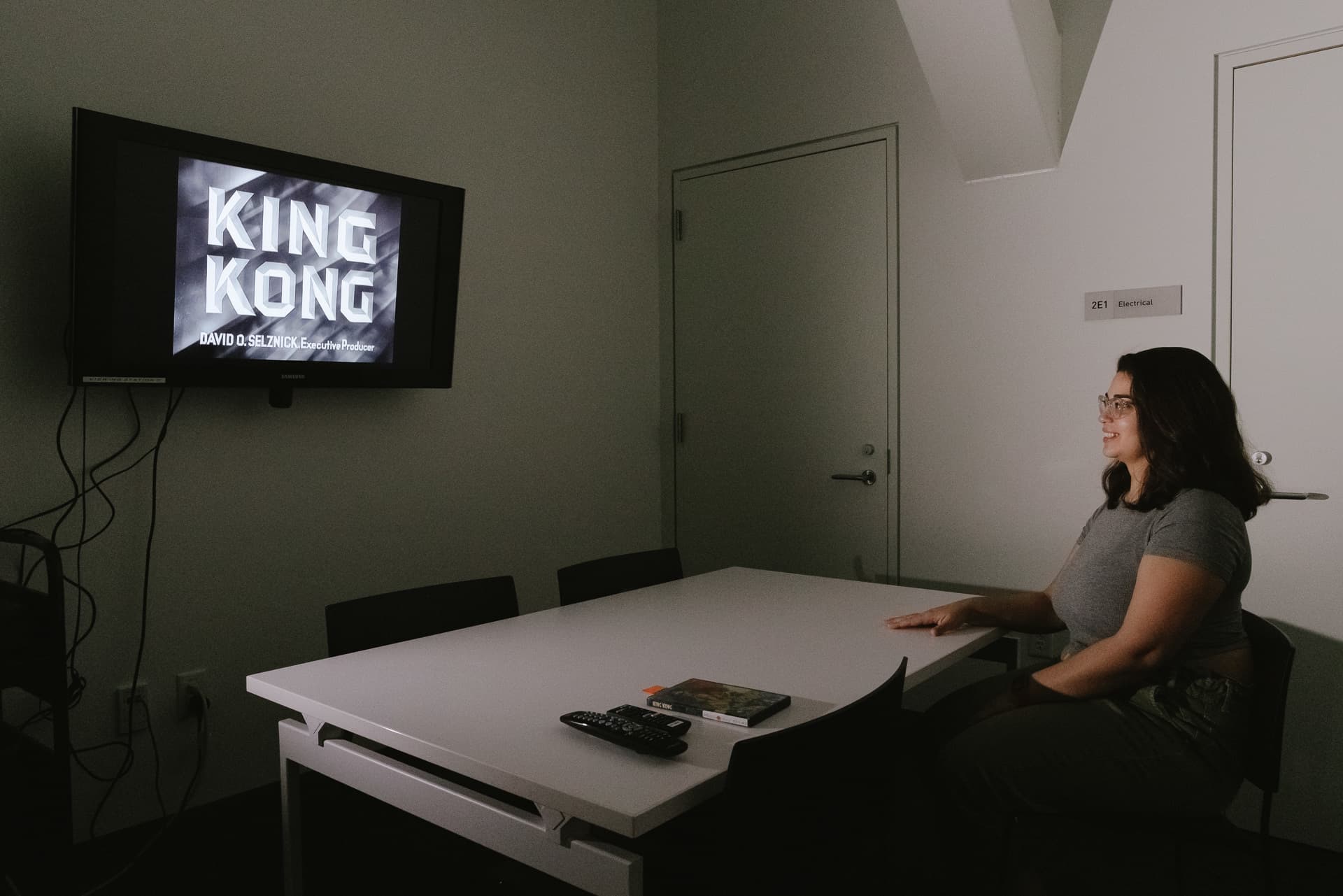 Student watching a video in the media viewing room